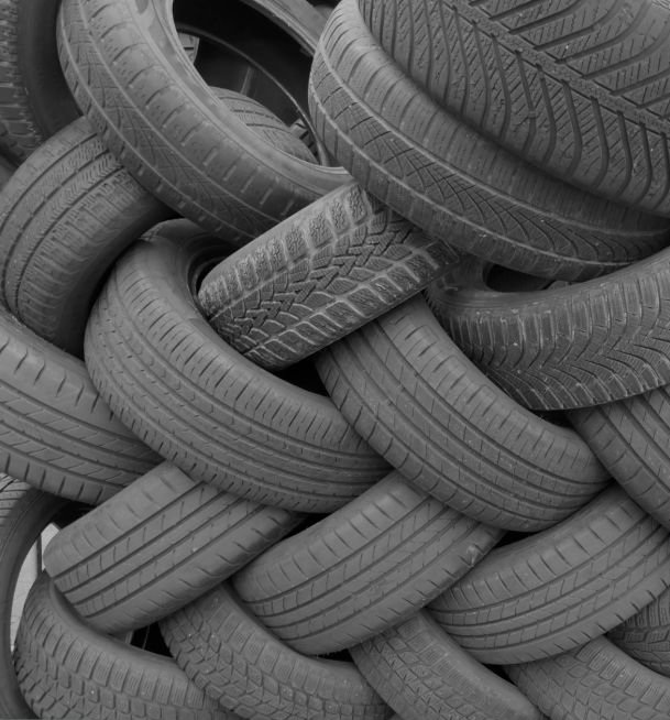 Old used tires from cars and trucks on a pile.
Ready for rubber recycling or waste disposal